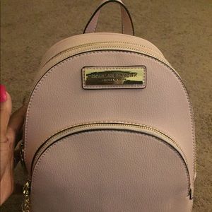 I have a Andrew New York Marc pink backpack purse